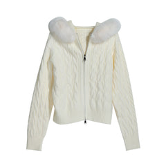 A cream-colored knitted sweater with fur trim on the shoulders and zipper.