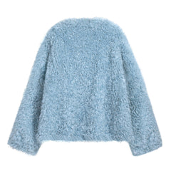 A light blue, fluffy, oversized sweater is shown against a white background.