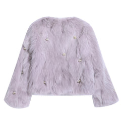 A long-sleeved, furry jacket with a light purple color and small, round embellishments on the sleeves.