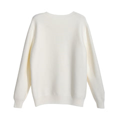A plain white knitted sweater with long sleeves.