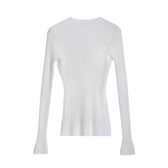 A white long-sleeved sweater with a ribbed texture.