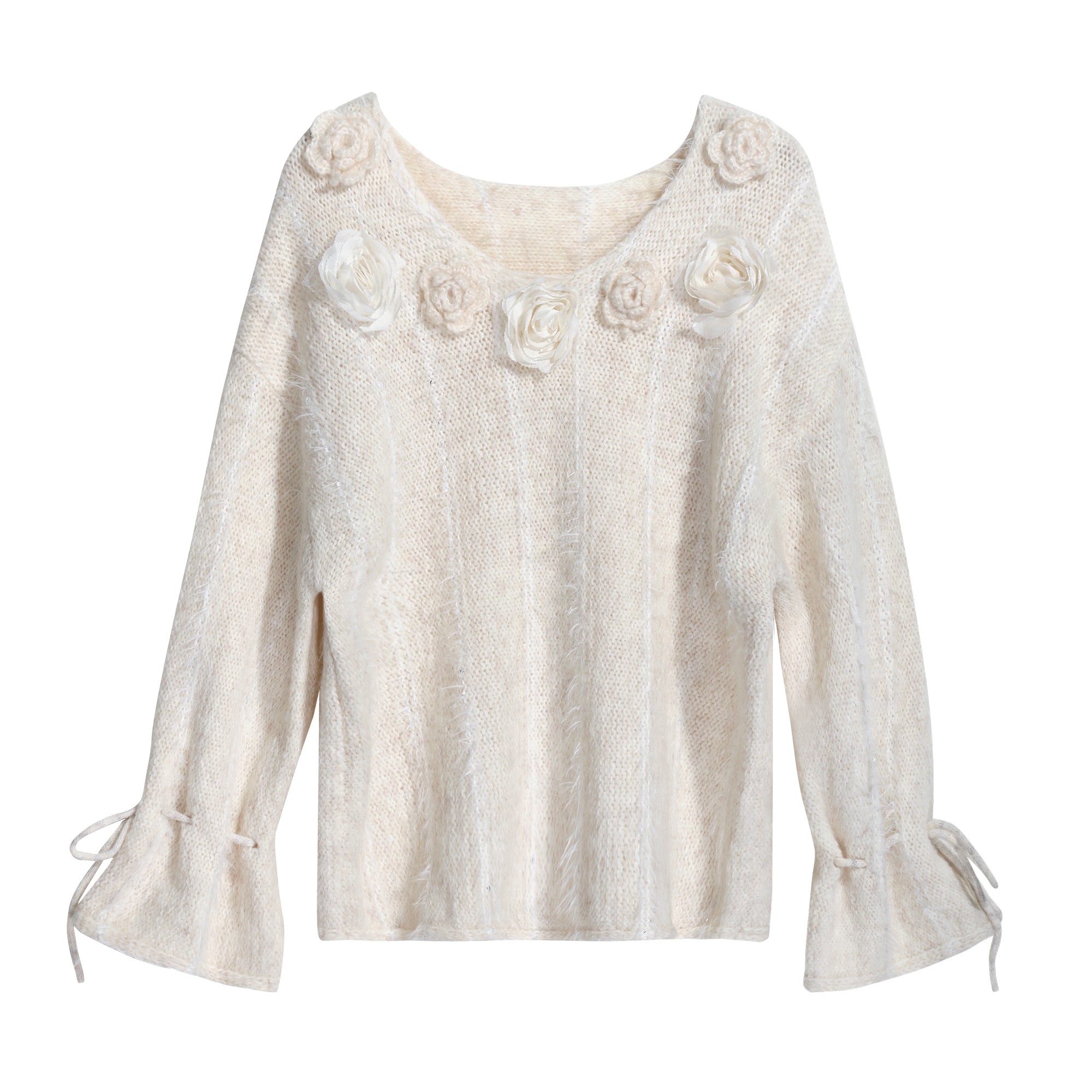 A cream-colored knitted sweater with a floral design on the front.