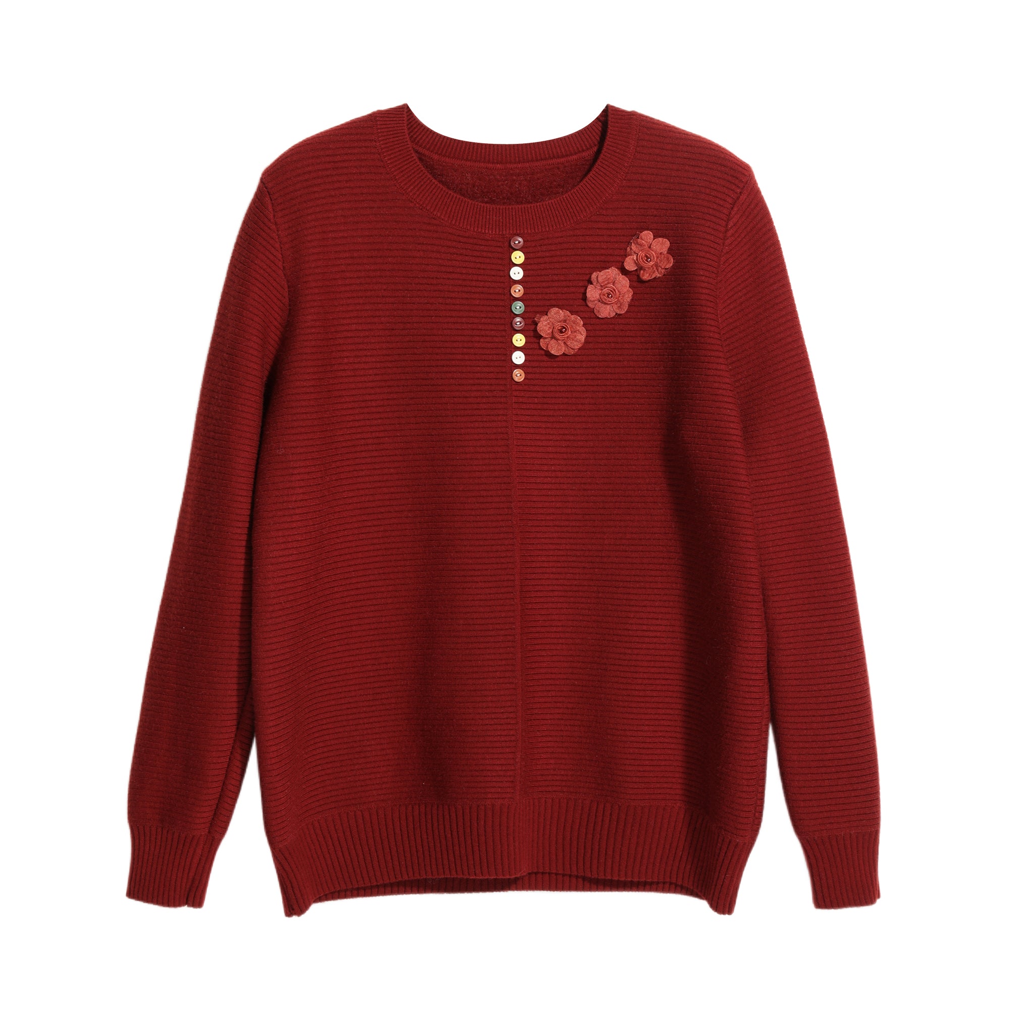 A red knitted sweater with a floral design on the front.