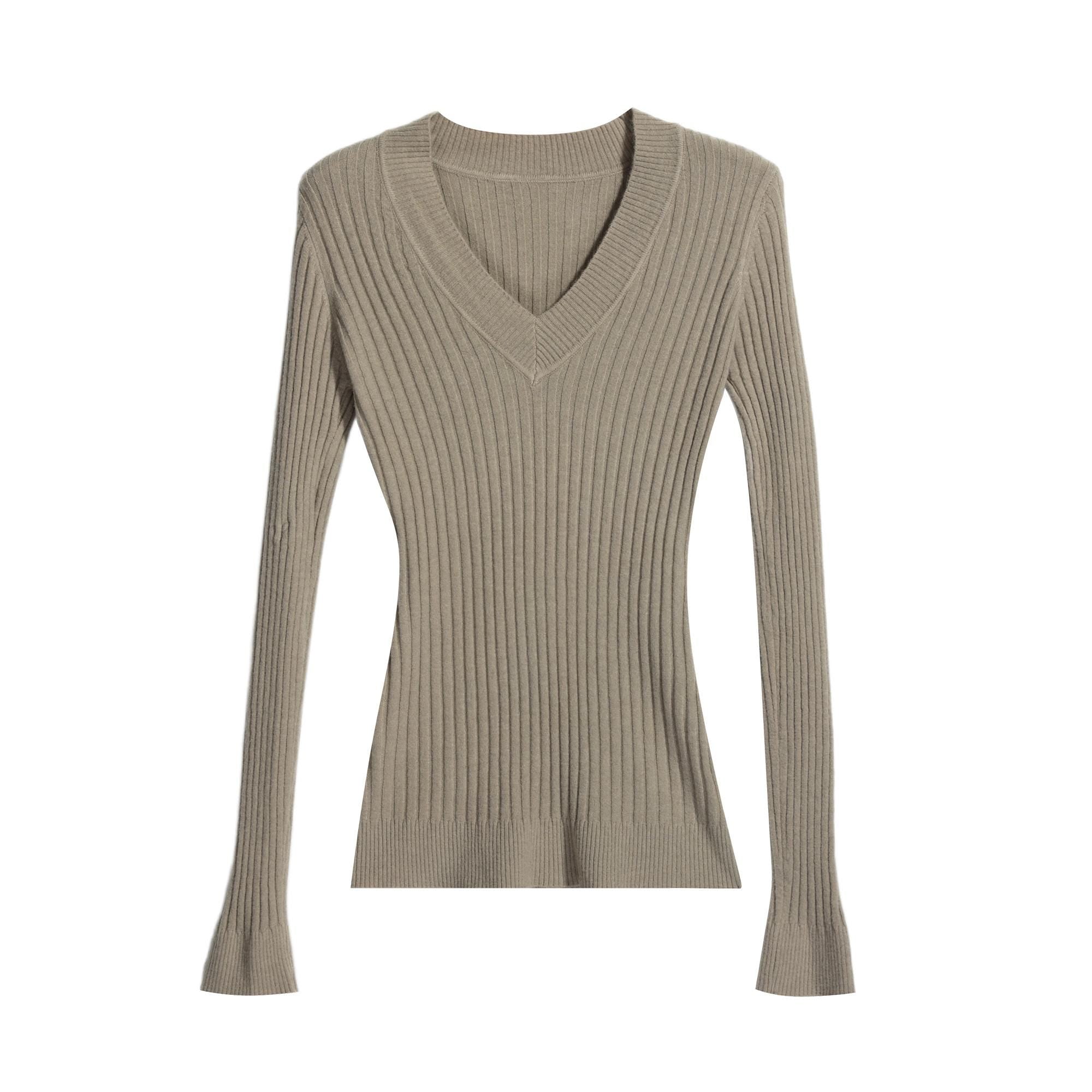 A beige ribbed sweater with long sleeves and a V-neckline.