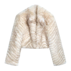 A white fur coat with a distinctive zigzag pattern on the sleeves and collar.