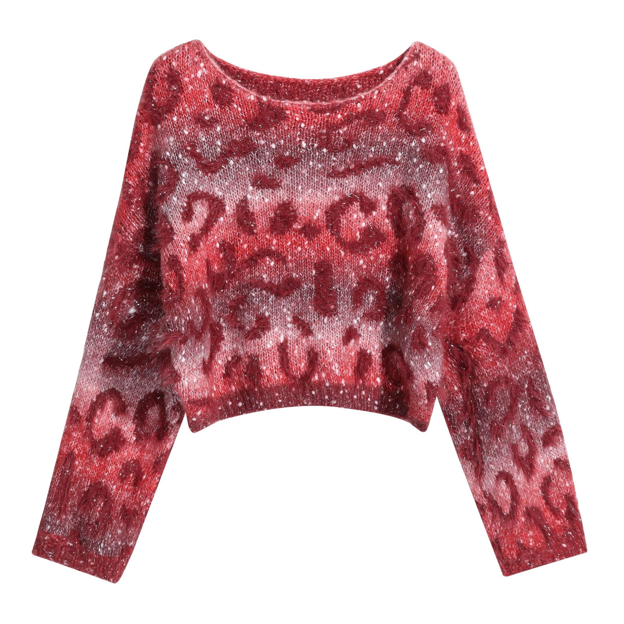 A red and white patterned sweater with a high neck and long sleeves.