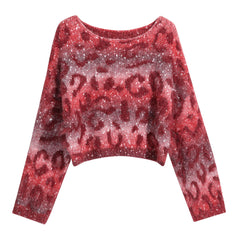 A red and white patterned sweater with a high neck and long sleeves.