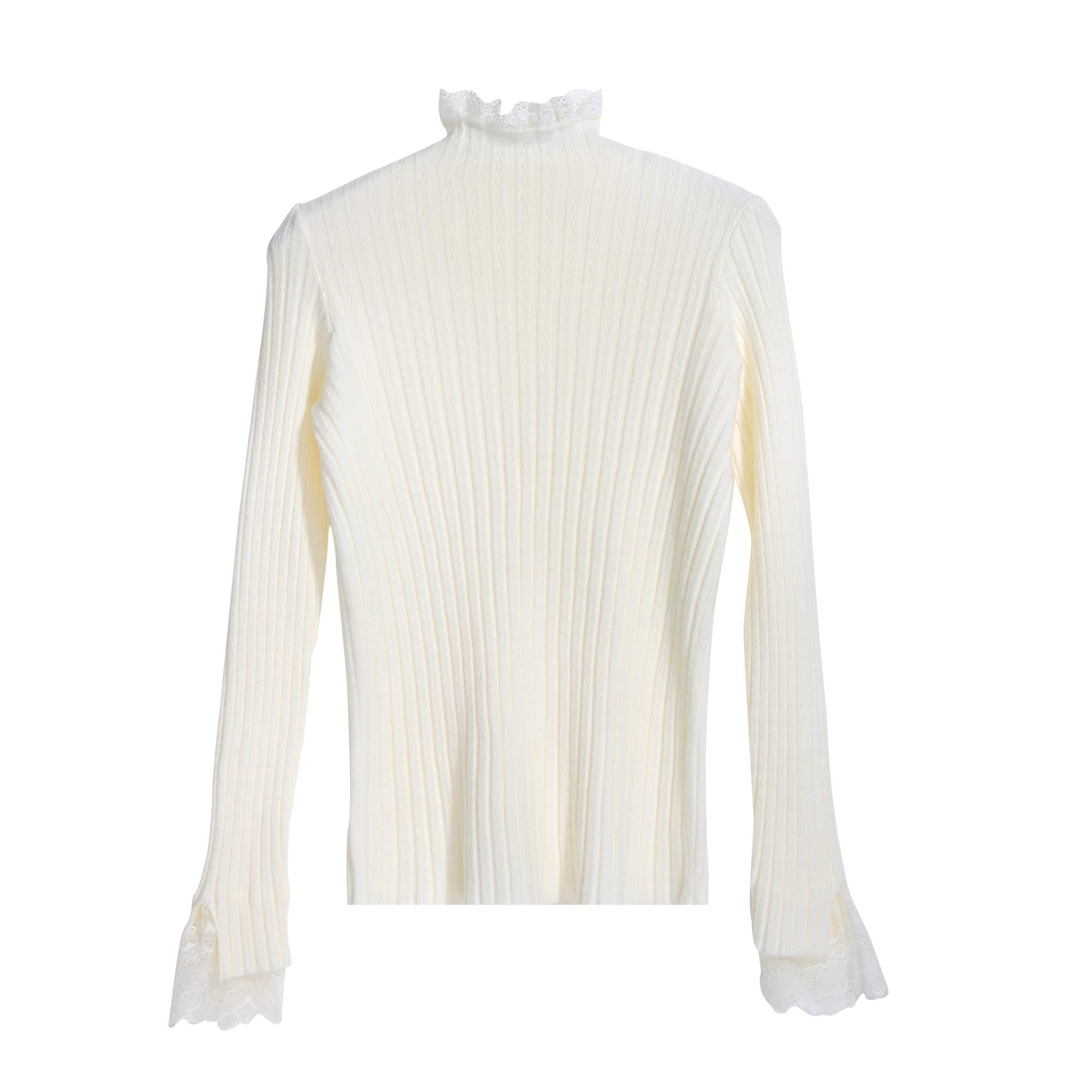 A white long-sleeved sweater with a ruffled collar and lace trim on the sleeves.