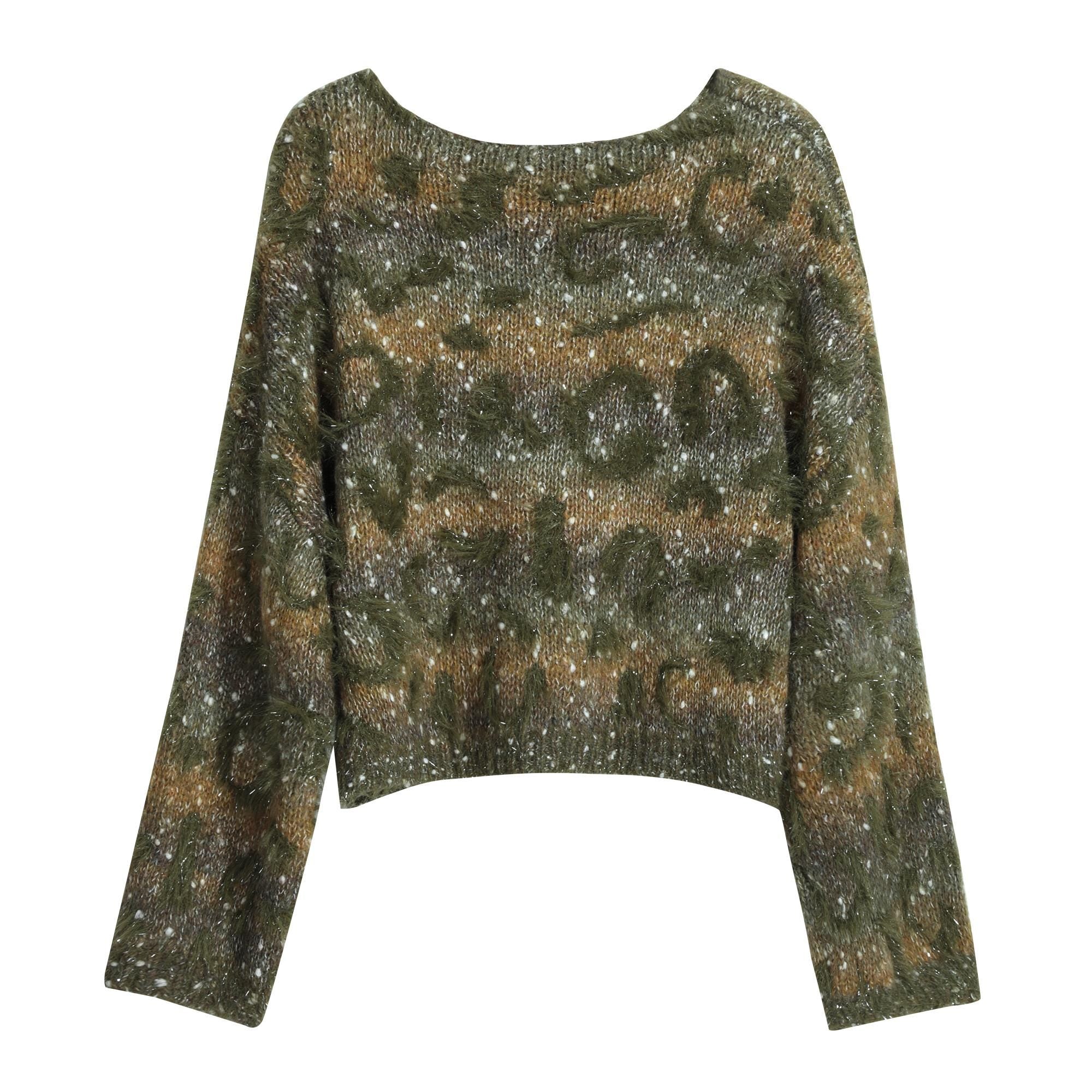 A long-sleeved sweater with a camouflage pattern and glittery texture.