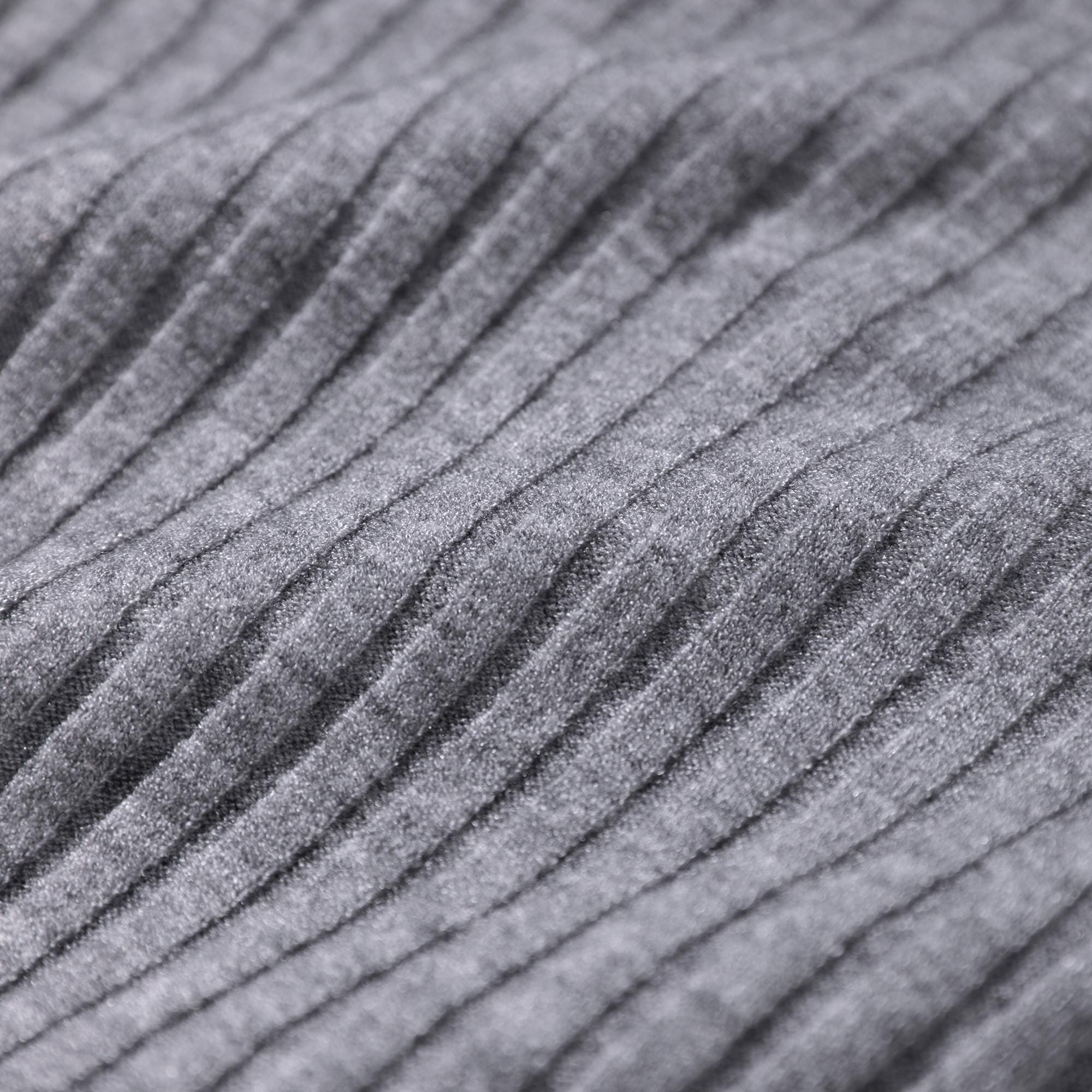 A close-up image of a gray, textured fabric with a ribbed or pleated pattern.