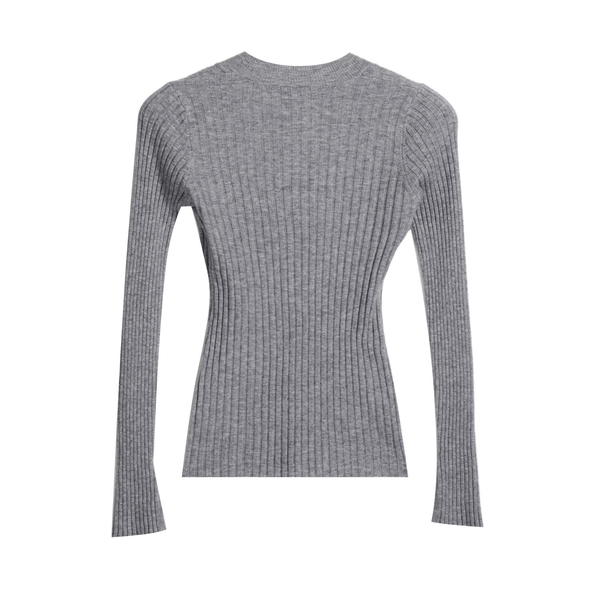 A gray ribbed sweater with long sleeves.