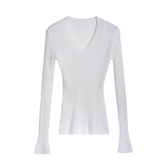 A white long-sleeved sweater with a v-neck and flared sleeves.