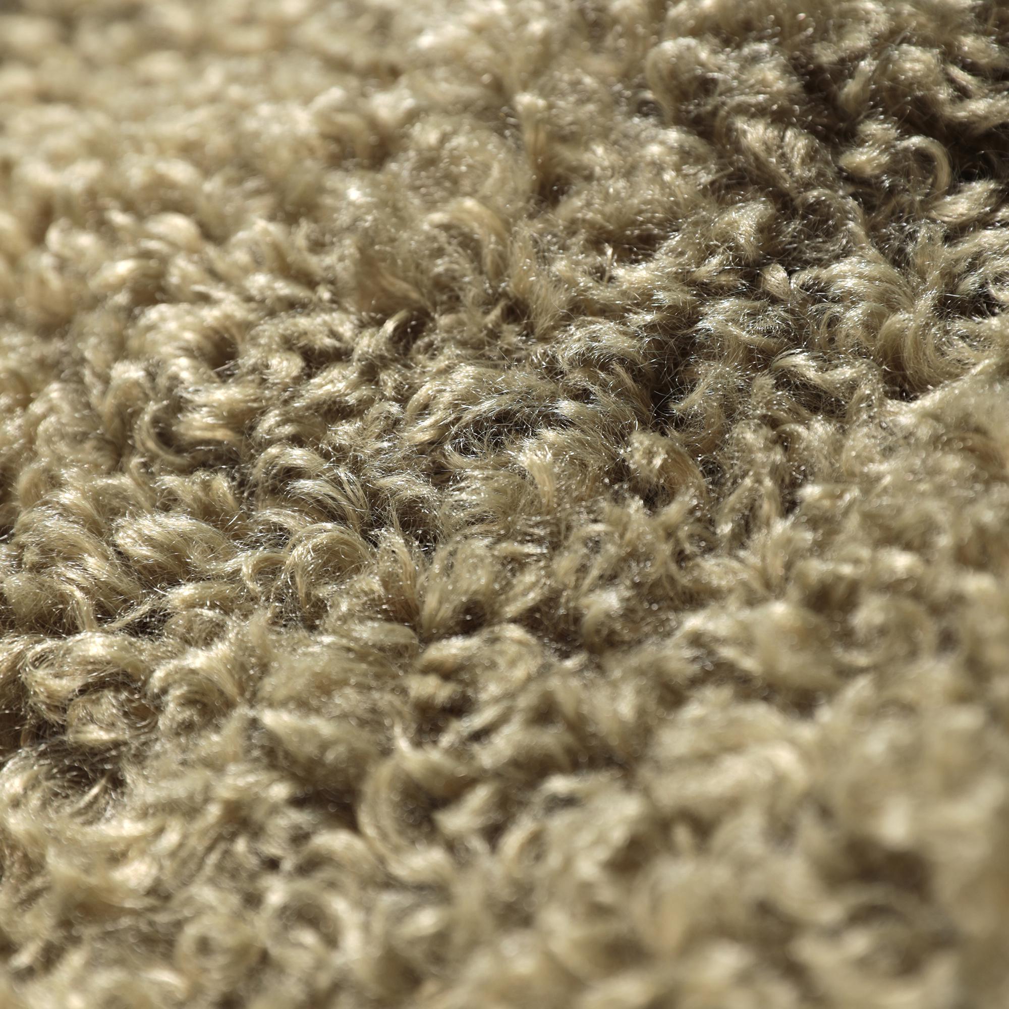 The image is a close-up of a fuzzy, textured surface, possibly a carpet or a fabric.