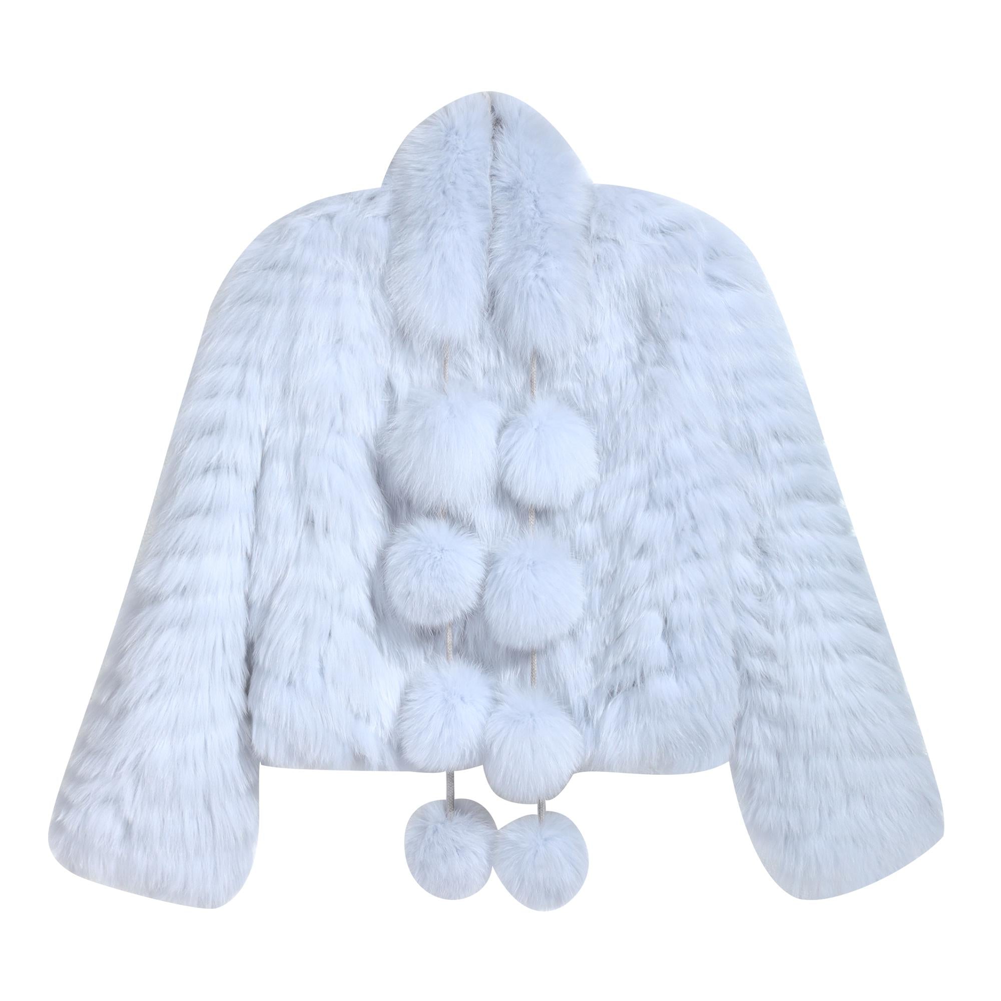 A white fur coat with pom poms hanging from the collar.