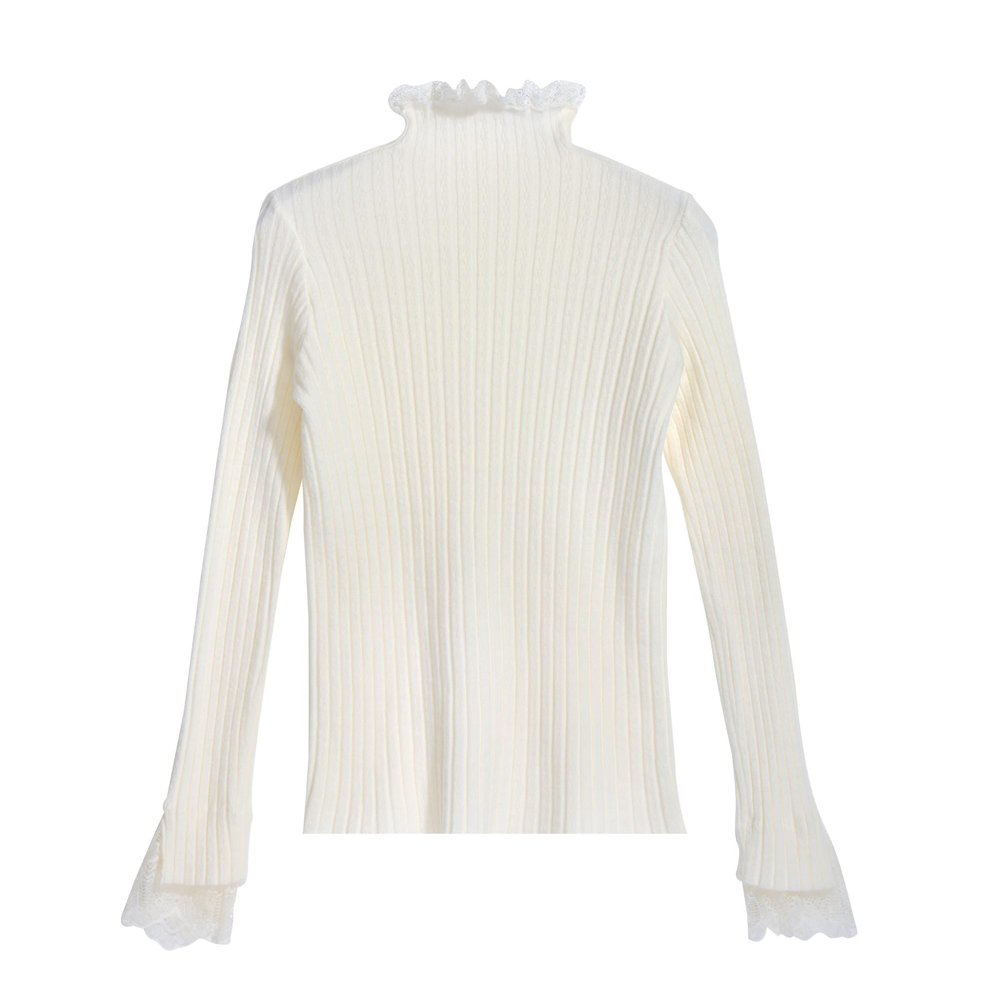 A white, long-sleeved sweater with a ruffled collar and lace trim on the sleeves.