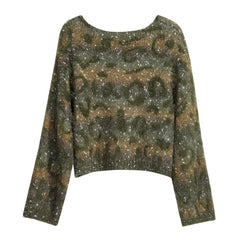 A long-sleeved sweater with a camouflage pattern and glittery texture.